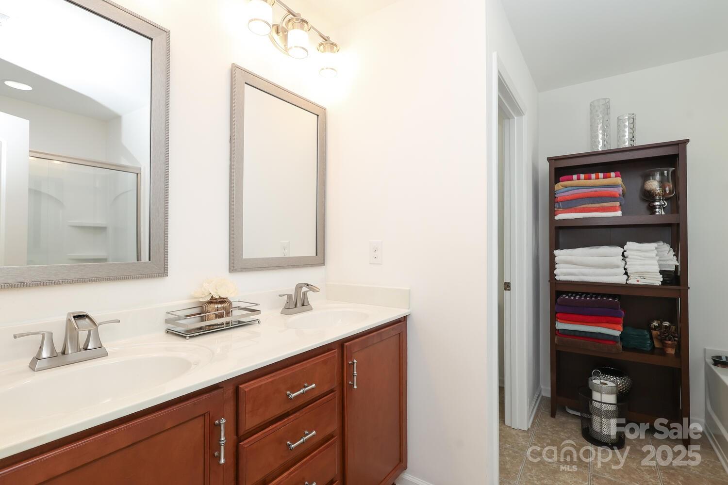 2104 Gillette Drive Clover, SC 29710 - Photo 24 of 33 a en suite bathroom with a sink and a mirror