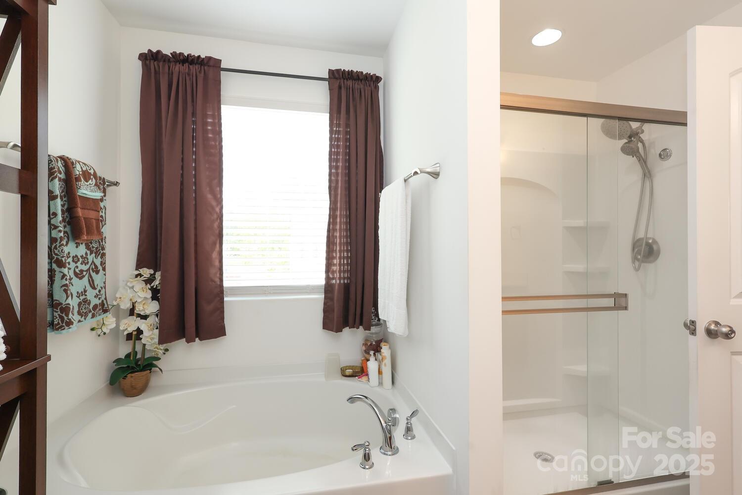 2104 Gillette Drive Clover, SC 29710 - Photo 25 of 33 a bathroom with a bathtub and a shower