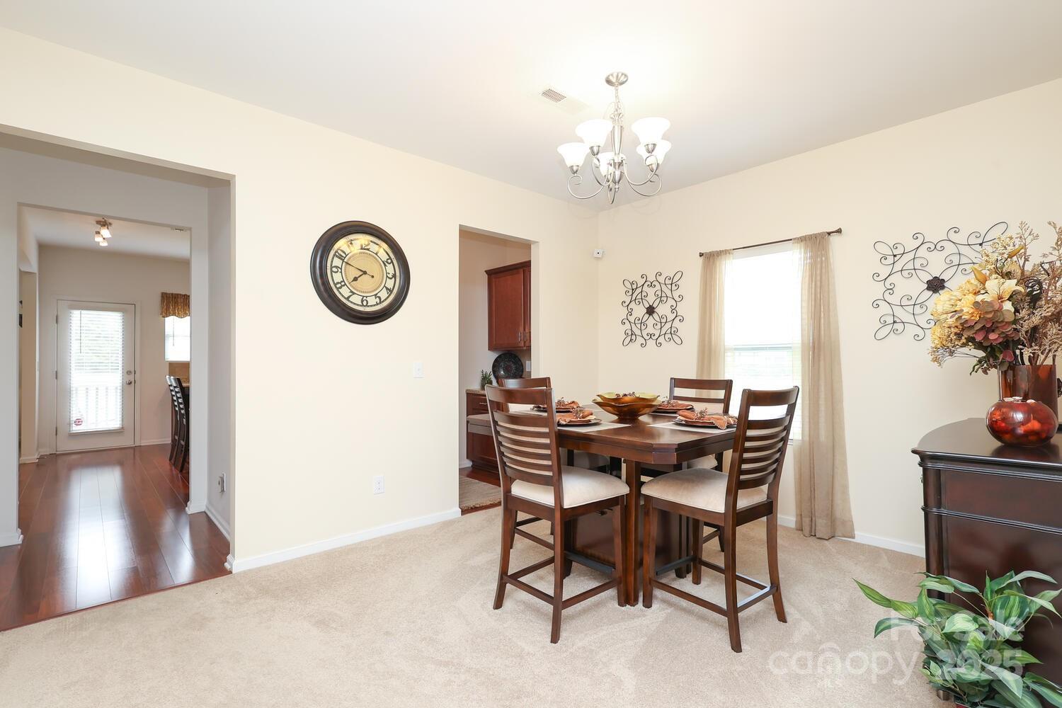 2104 Gillette Drive Clover, SC 29710 - Photo 8 of 33 a view of a dining room with furniture and chandelier