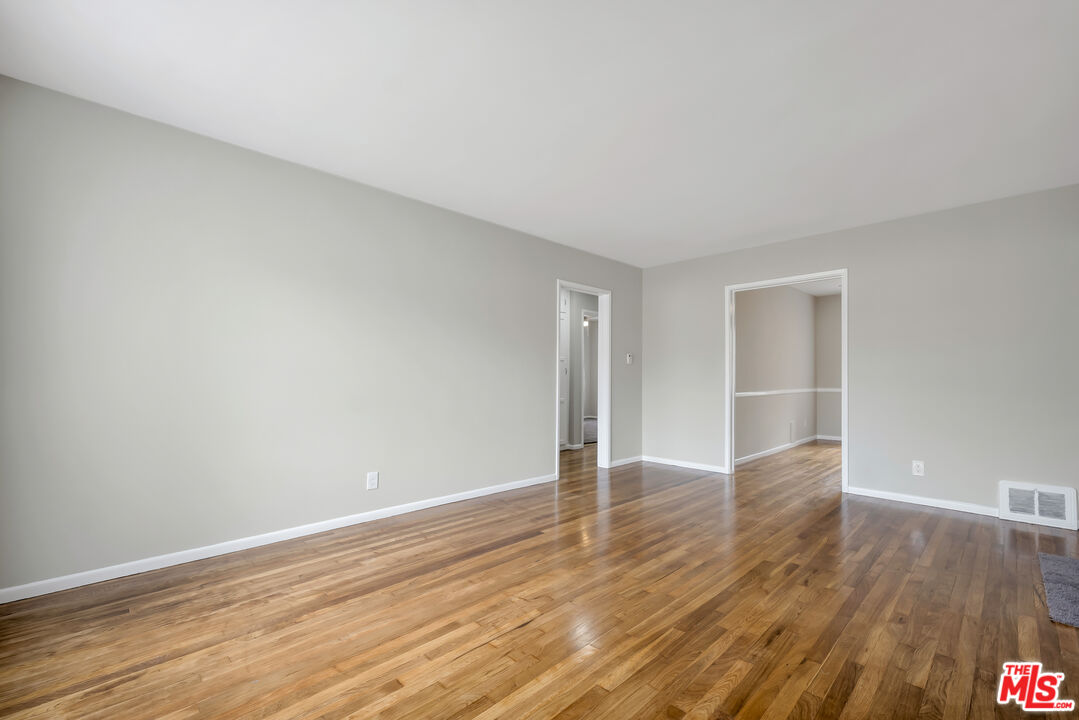 4086 Abourne Road, Unit A Los Angeles, CA 90008 - Photo 17 of 36 a view of an empty room with wooden floor and closet