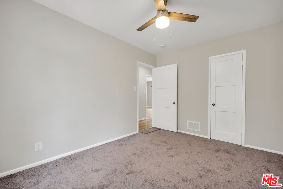 4086 Abourne Road, Unit A Los Angeles, CA 90008 - Photo 25 of 36 an empty room with a empty space and a ceiling fan