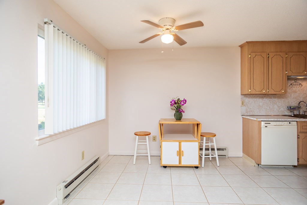 7 Susan Road, Unit 4 Wareham, MA 02532 - Photo 8 of 26 a room with furniture a chandelier and a window