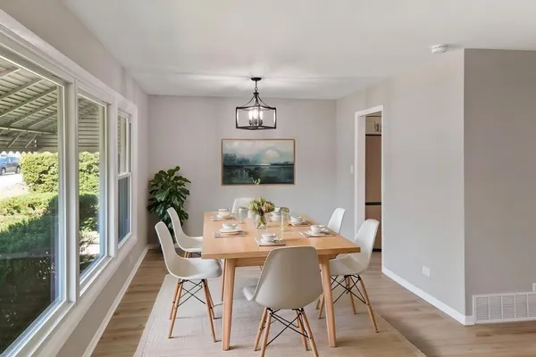 a view of a dining room with furniture window and outside view