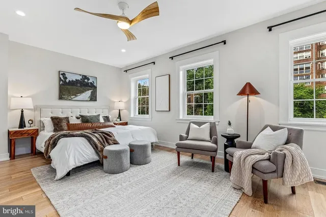 a bedroom with bed and a couch