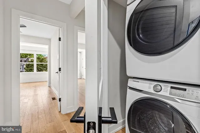 a view of a hallway with washer and dryer