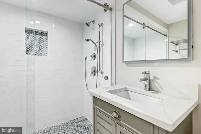 a bathroom with a sink and a mirror