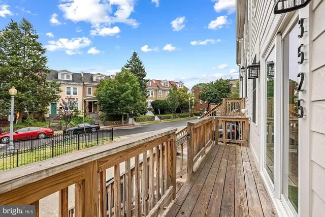 a view of a balcony with wooden floor
