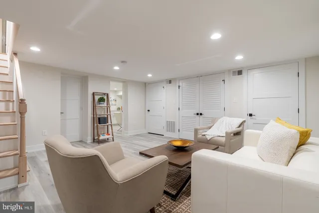 a living room with furniture and a table