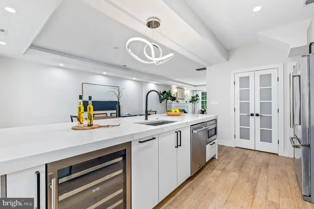 a kitchen with a sink and cabinets