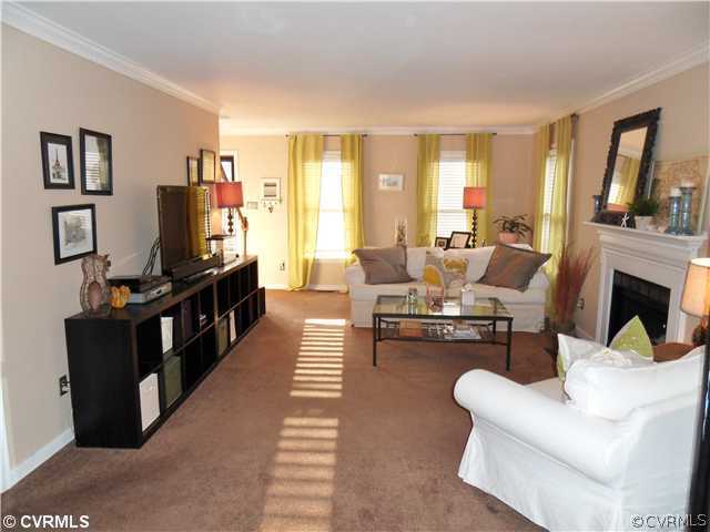 5425 Standing Oak Road Midlothian, VA 23112 - Photo 3 of 18 a living room with furniture fireplace and a large window
