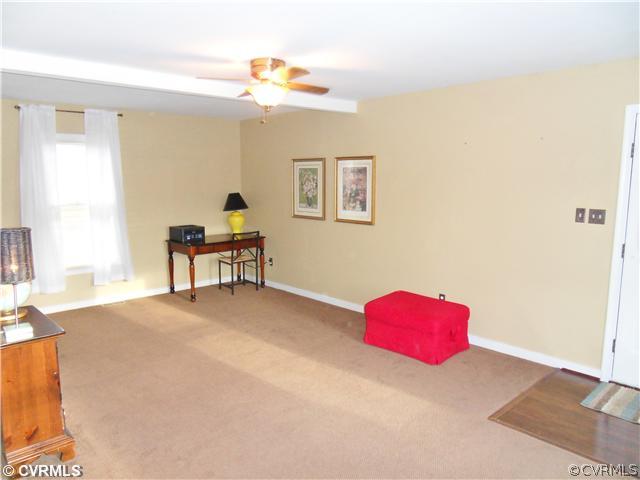 5425 Standing Oak Road Midlothian, VA 23112 - Photo 7 of 18 a bedroom with a bed and a chandelier
