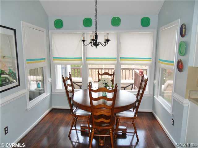 5425 Standing Oak Road Midlothian, VA 23112 - Photo 10 of 18 a view of a dining room with furniture and windows