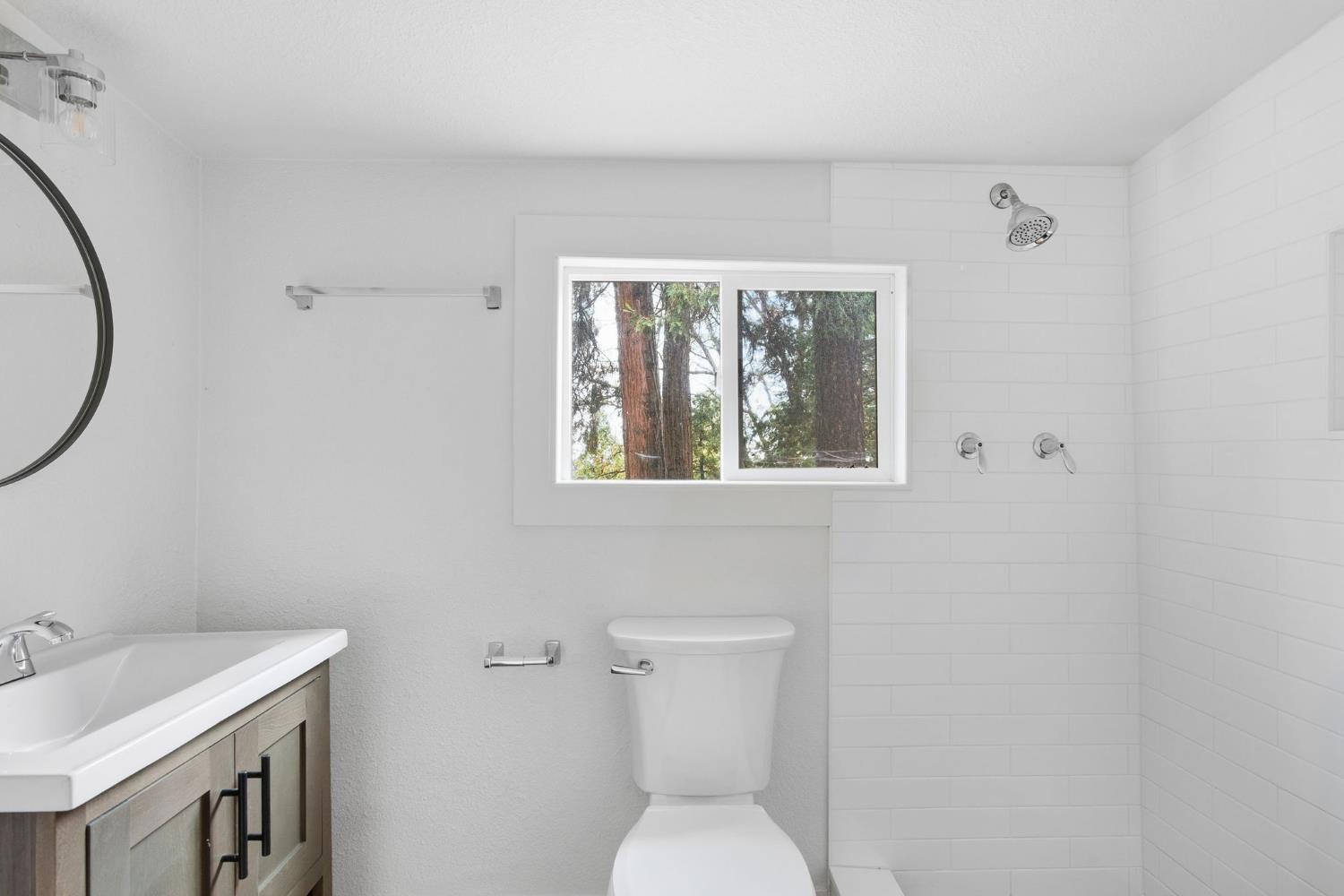 19159 Allan Road Volcano, CA 95689 - Photo 11 of 27 a bathroom with a toilet and a sink