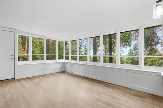 a view of an empty room with a large window