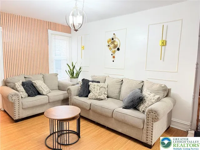 a living room with furniture and a table