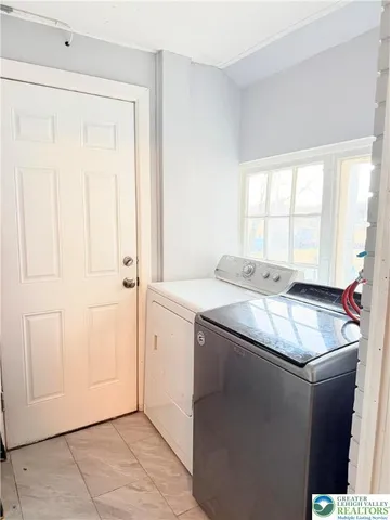 a kitchen with granite countertop a sink and a window