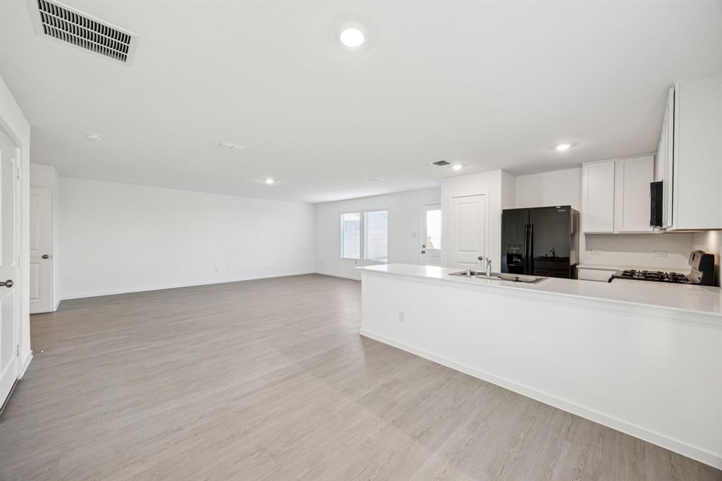 11550 Gammon Avenue Rhome, TX 76078 - Photo 13 of 29 a view of kitchen with refrigerator sink and stove