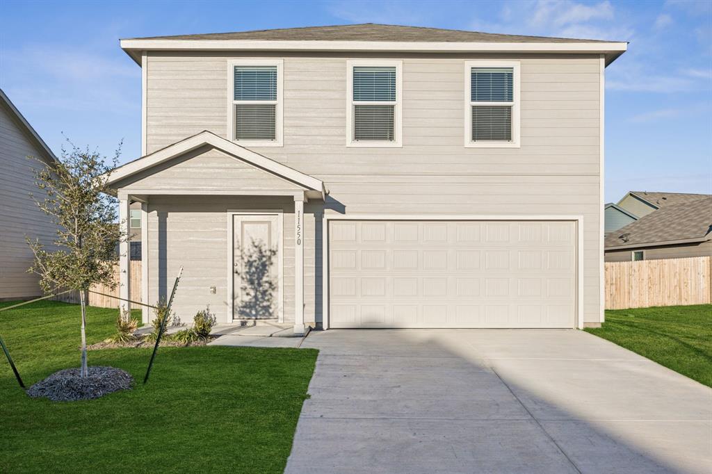 11550 Gammon Avenue Rhome, TX 76078 - Photo 2 of 29 a front view of a house with a yard
