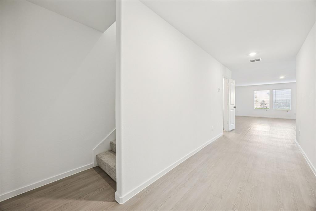 11550 Gammon Avenue Rhome, TX 76078 - Photo 4 of 29 a view of hallway with a white walls