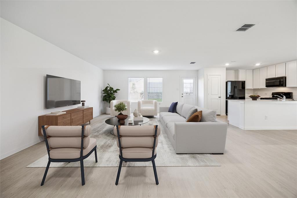 11550 Gammon Avenue Rhome, TX 76078 - Photo 5 of 29 a living room with furniture and a flat screen tv