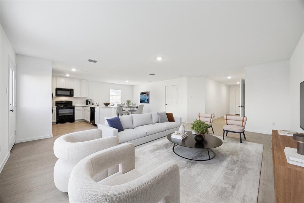 11550 Gammon Avenue Rhome, TX 76078 - Photo 7 of 29 a living room with furniture potted plant and kitchen view