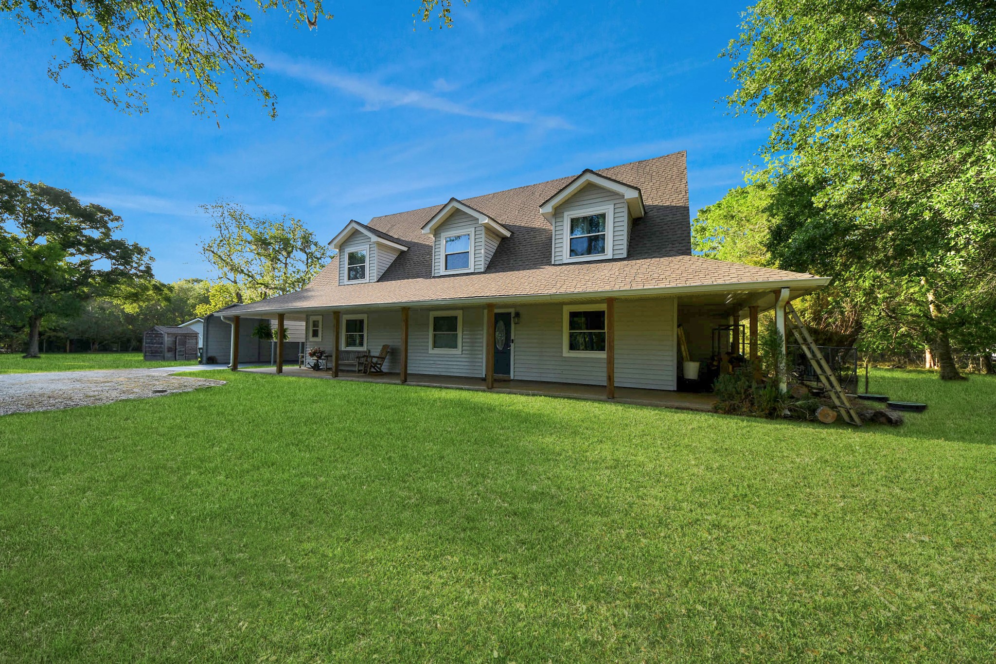 20202 Deer Run Road Damon, TX 77430 - Photo 5 of 45 a front view of a house with a garden
