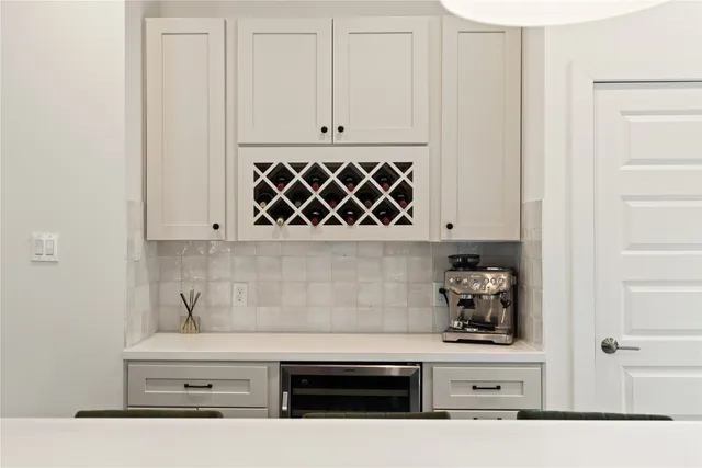 a white stove top oven sitting inside of a kitchen