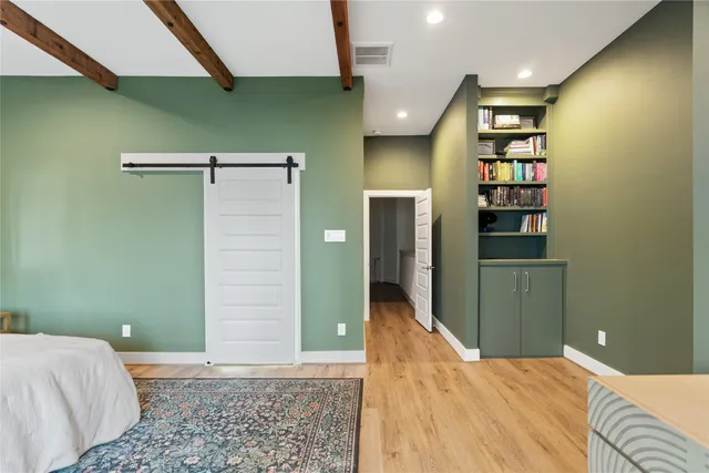 a bedroom with a bed and a walk in closet