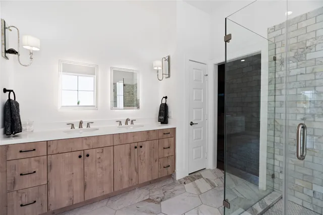 a bathroom with a double vanity sink a and a mirror