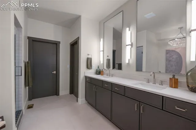 a bathroom with a double vanity sink mirror and double