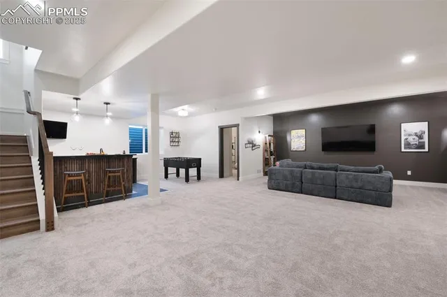 a large bedroom with a large bed and a television in it