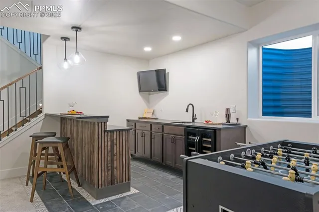 a kitchen with stainless steel appliances granite countertop a stove and a sink