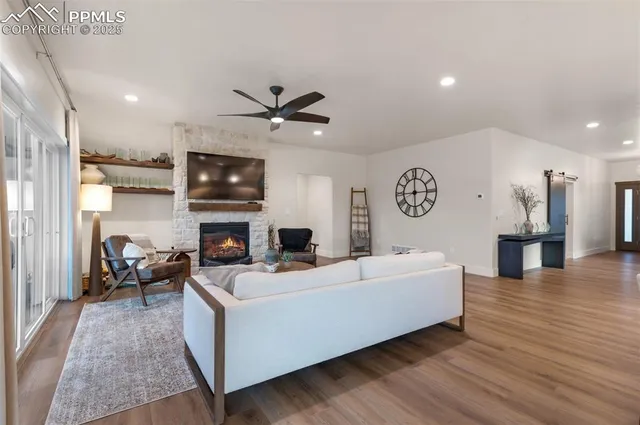 a living room with furniture and a fireplace