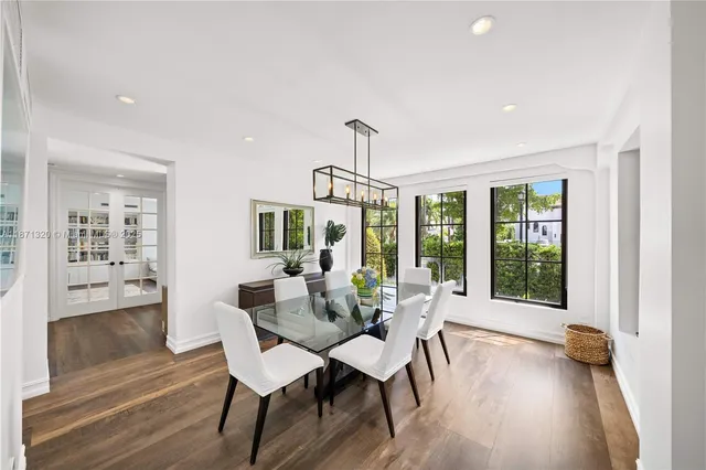 a spacious bedroom with a large bed and a large window