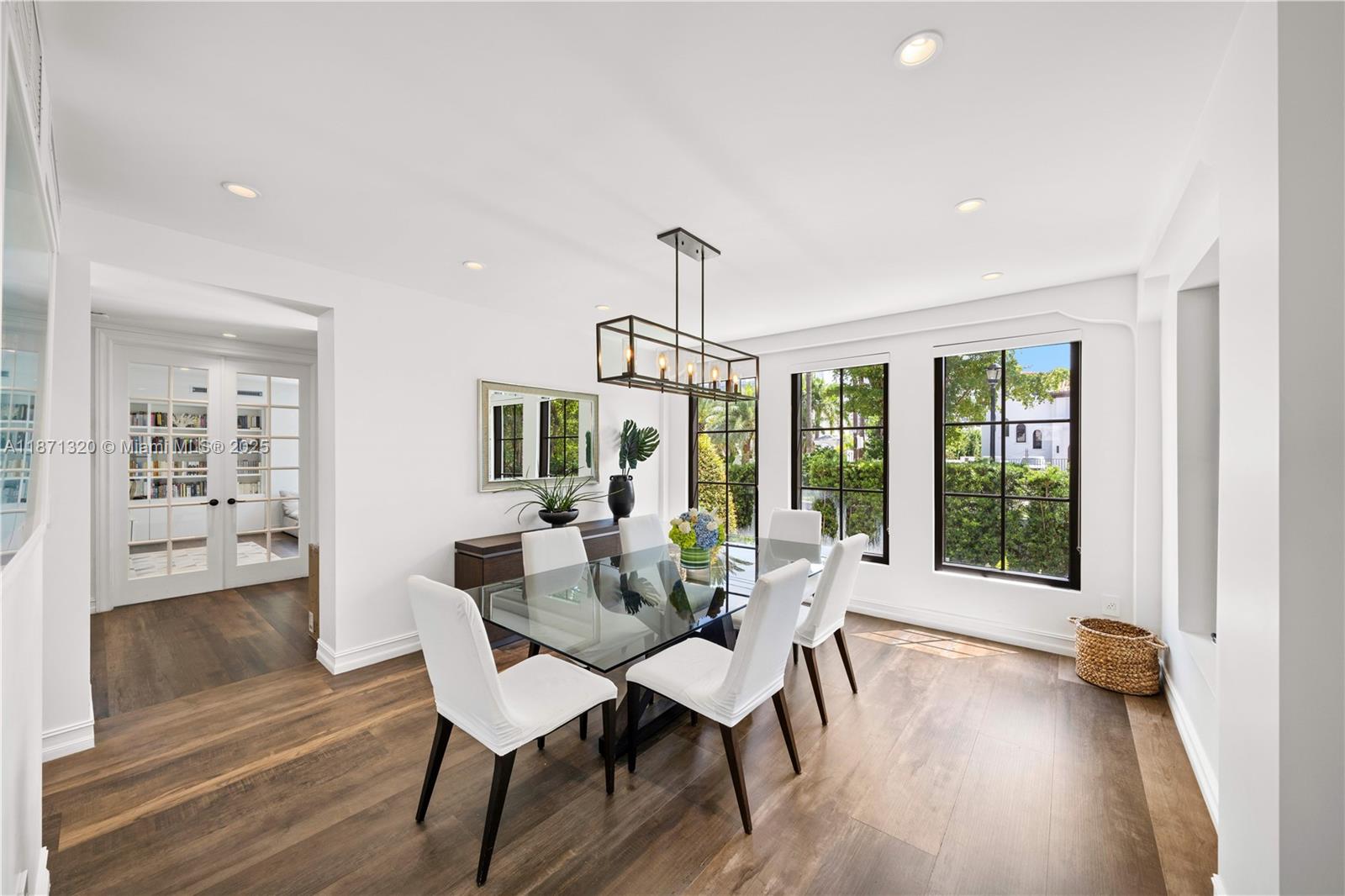 5728 Pine Tree Drive Miami Beach, FL 33140 - Photo 17 of 49 a dining room with furniture and wooden floor