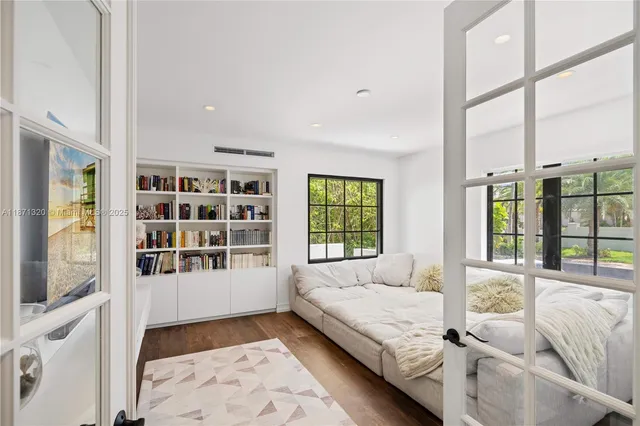 a spacious bedroom with a large bed and a couch