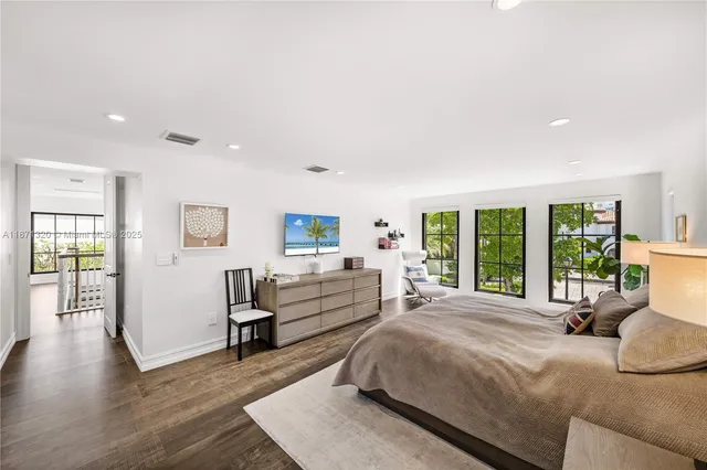 a large bathroom with a large tub and sink