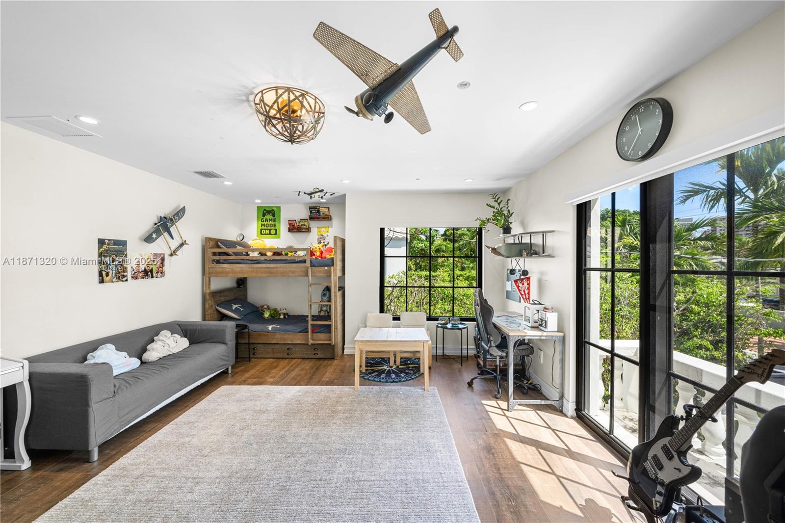 5728 Pine Tree Drive Miami Beach, FL 33140 - Photo 26 of 49 a living room with furniture and a window