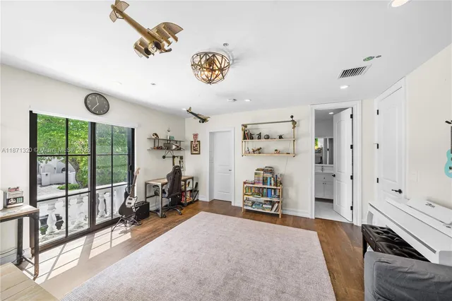 a bathroom with a sink shower and a mirror