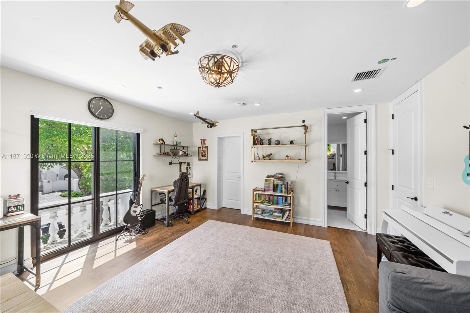 5728 Pine Tree Drive Miami Beach, FL 33140 - Photo 27 of 49 a view of a livingroom with furniture and a large window