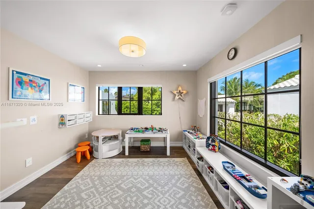 a living room with furniture fireplace and window