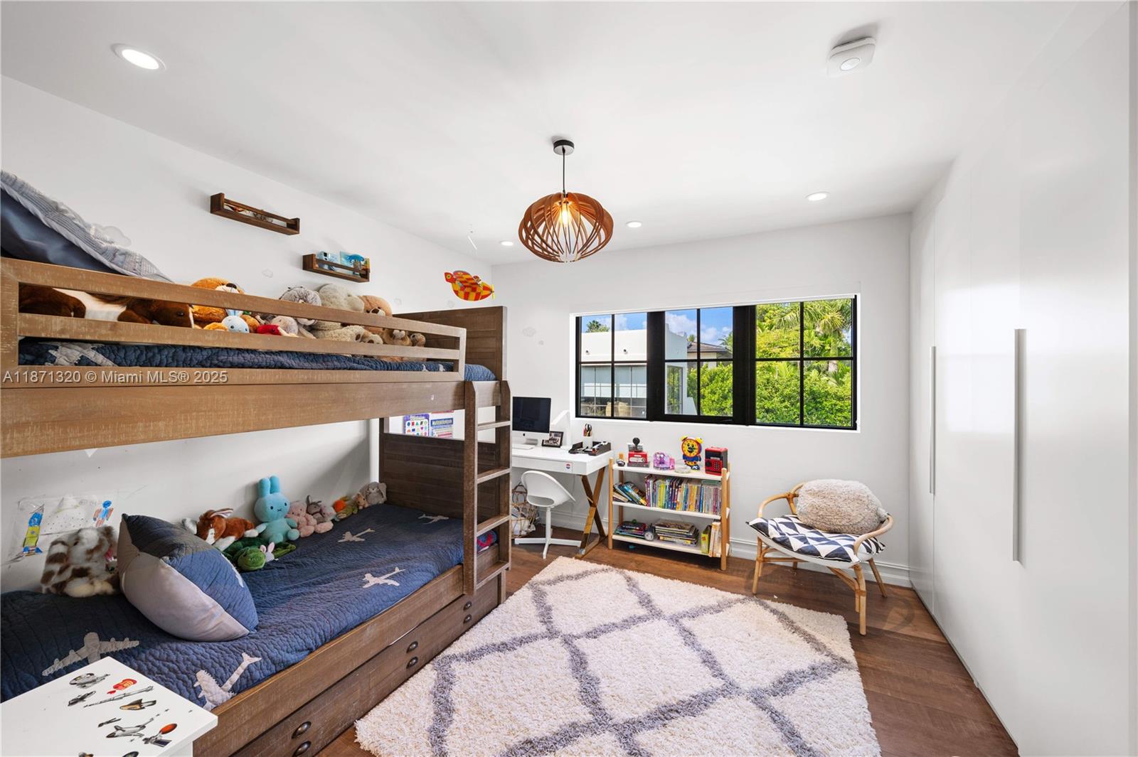 5728 Pine Tree Drive Miami Beach, FL 33140 - Photo 30 of 49 a living room with furniture fireplace and window