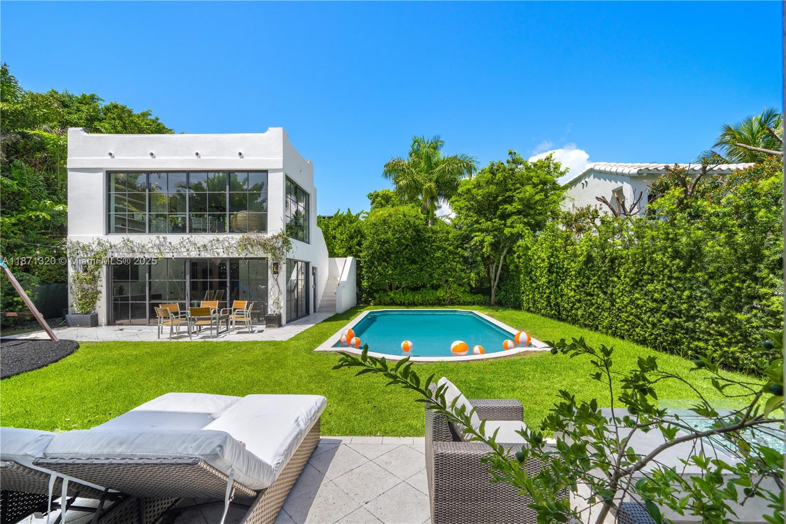 5728 Pine Tree Drive Miami Beach, FL 33140 - Photo 33 of 49 a view of yard with swimming pool and green space