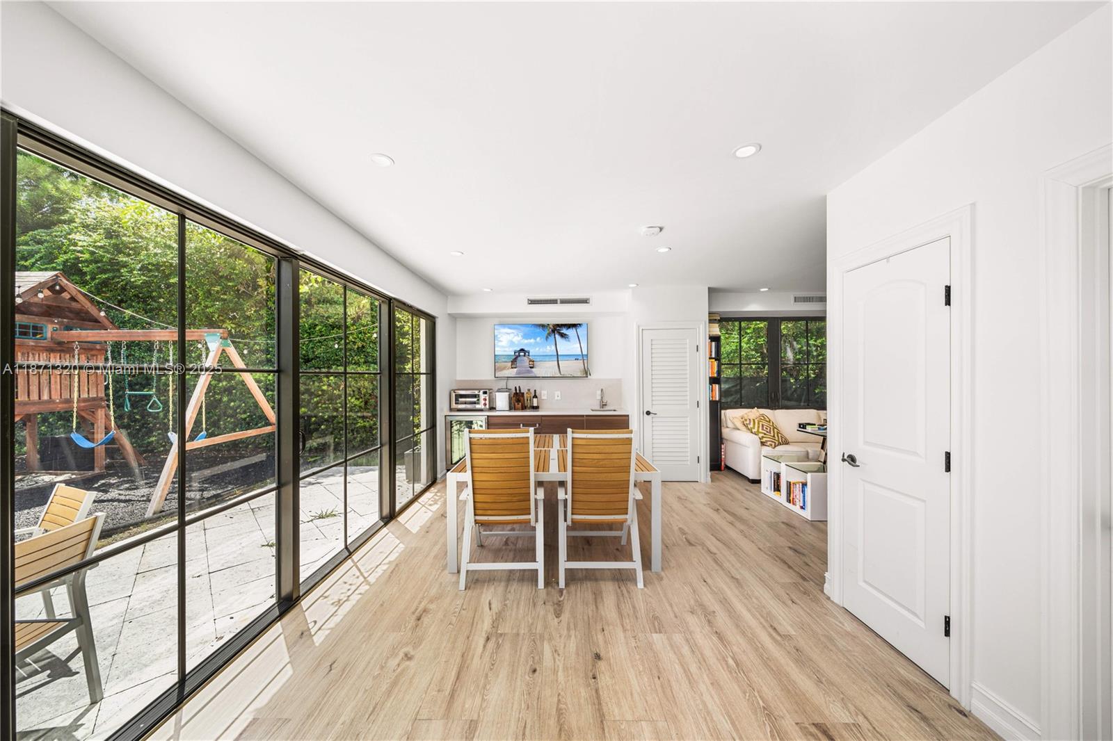 5728 Pine Tree Drive Miami Beach, FL 33140 - Photo 35 of 49 a view of kitchen with furniture and large window