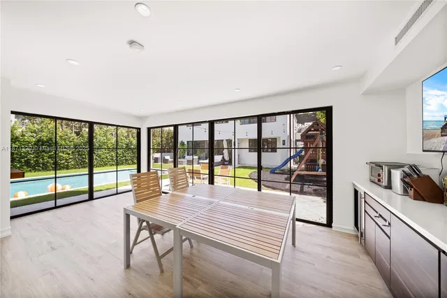 a bathroom with a shower sink vanity mirror and toilet