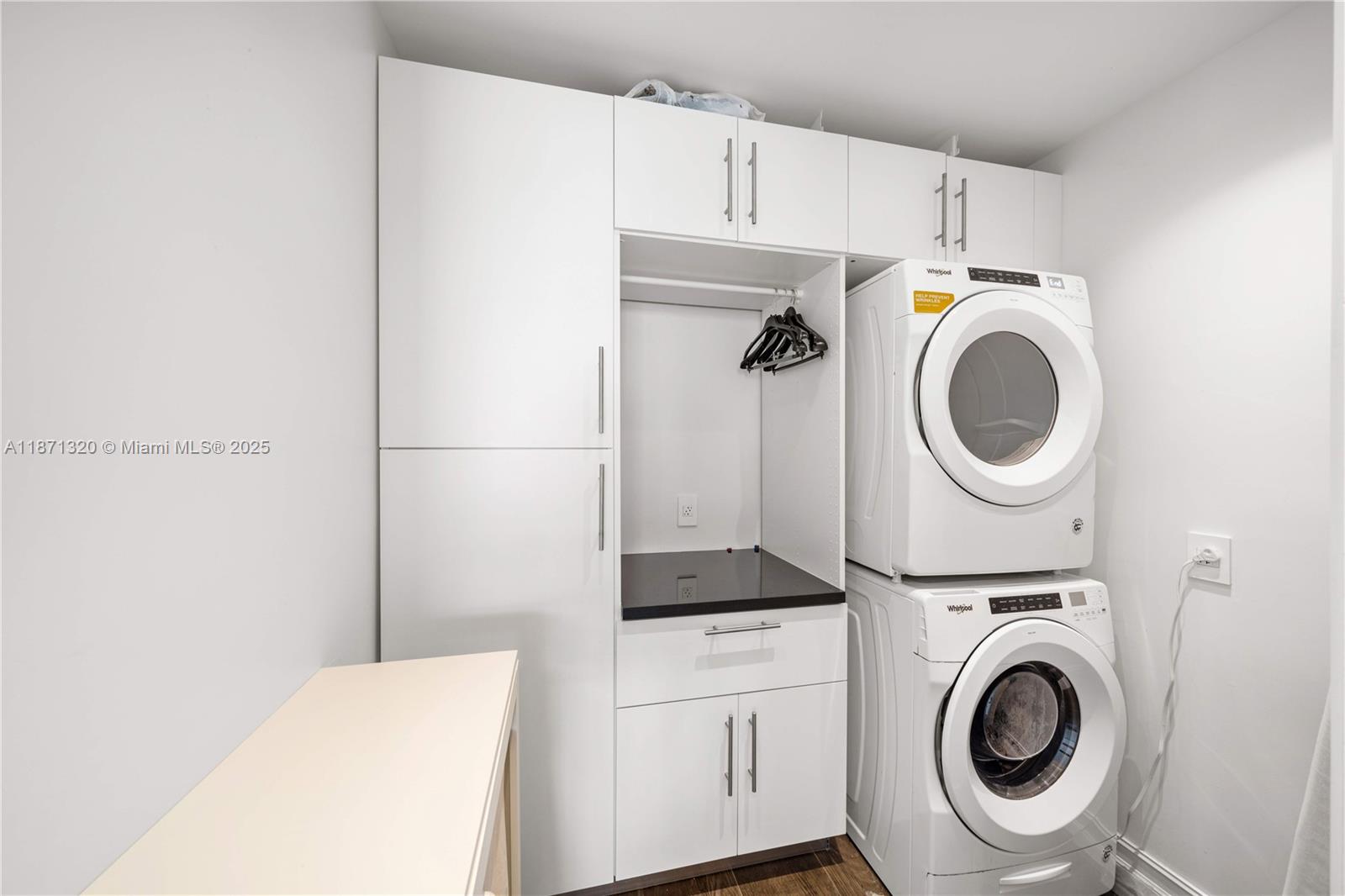 5728 Pine Tree Drive Miami Beach, FL 33140 - Photo 42 of 49 a utility room with dryer and washer