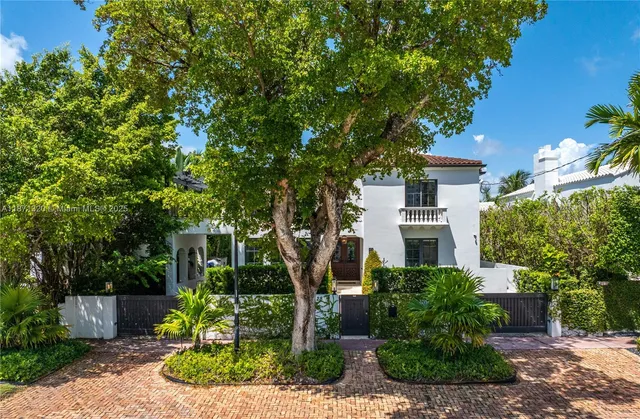 large aerial view of a house with a lake view