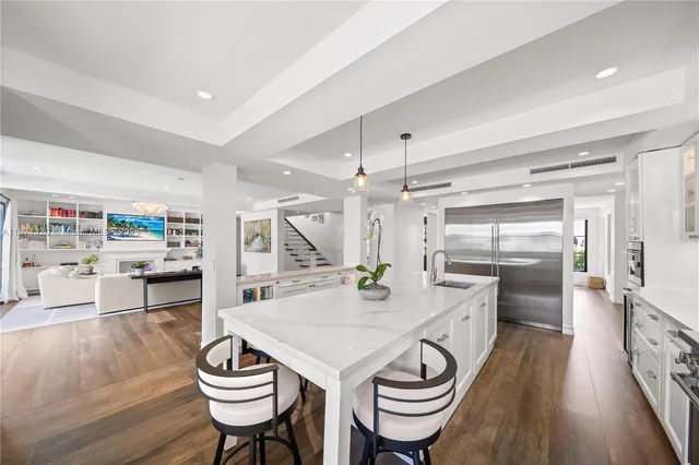 a large kitchen with a table and chairs