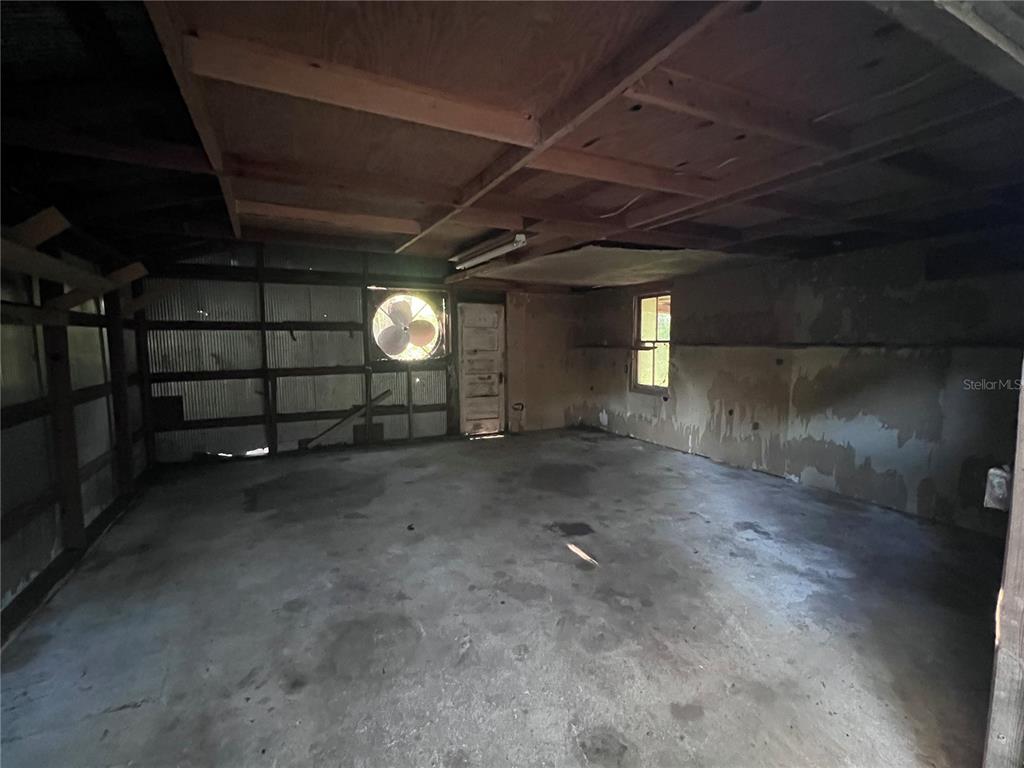 177 East 3rd Avenue Pierson, FL 32180 - Photo 7 of 16 a view of a room with wooden walls