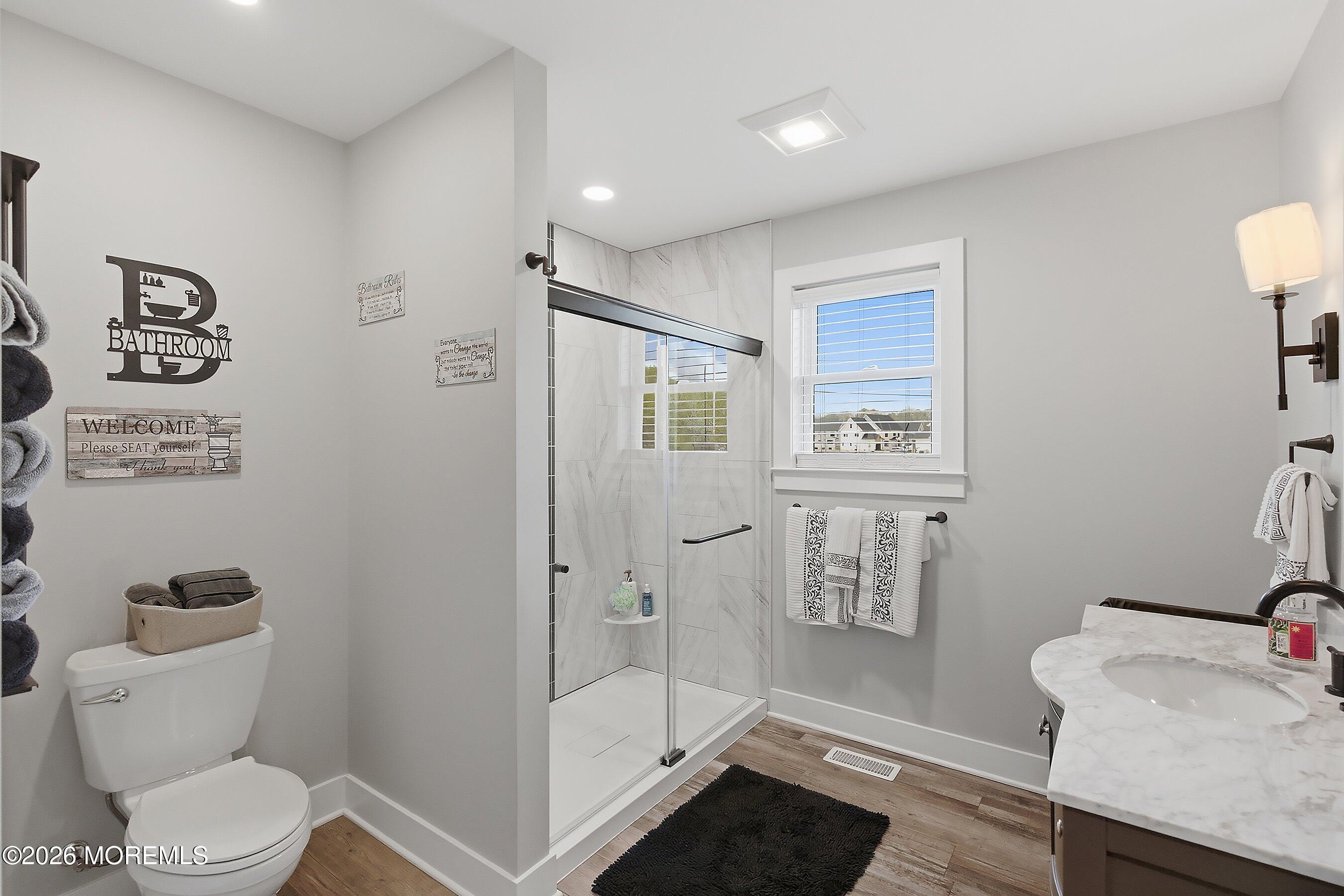 83 Whitesville Road Jackson, NJ 08527 - Photo 13 of 31 a bathroom with a toilet a sink and shower